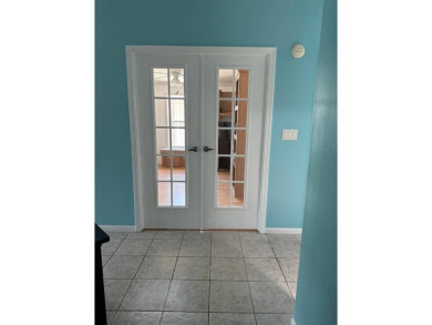 ENJOY PEACEFUL WATERFRONT LIVING IN THIS BRIGHT AND SPACIOUS on Schalamar Creek Golf and Country Club in Florida - for sale on GolfHomes.com, golf home, golf lot