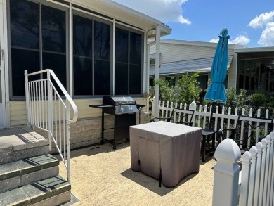 ENJOY PEACEFUL WATERFRONT LIVING IN THIS BRIGHT AND SPACIOUS on Schalamar Creek Golf and Country Club in Florida - for sale on GolfHomes.com, golf home, golf lot