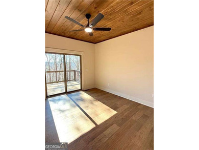 Welcome to this custom-built modern craftsman cabin nestled on White Path Golf Club in Georgia - for sale on GolfHomes.com, golf home, golf lot