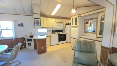 ENJOY THE WATER VIEW FROM THIS TWO BEDROOM 1 1/2 BATH MOBILE on River Run Golf Links in Florida - for sale on GolfHomes.com, golf home, golf lot