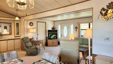 ENJOY THE WATER VIEW FROM THIS TWO BEDROOM 1 1/2 BATH MOBILE on River Run Golf Links in Florida - for sale on GolfHomes.com, golf home, golf lot