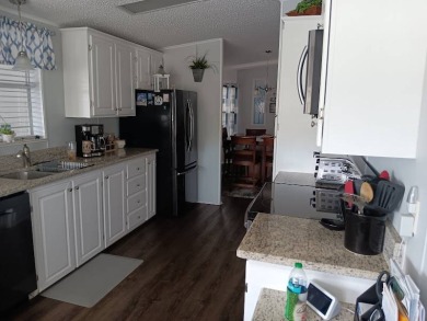 This Beautiful, well maintained home is located with views of on Four Lakes Golf Club in Florida - for sale on GolfHomes.com, golf home, golf lot
