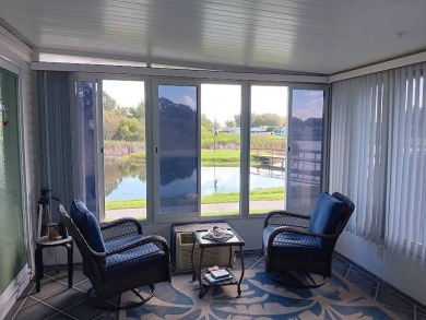 This Beautiful, well maintained home is located with views of on Four Lakes Golf Club in Florida - for sale on GolfHomes.com, golf home, golf lot