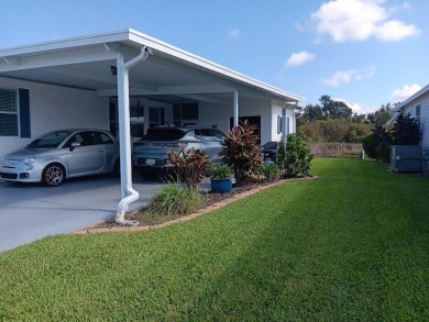 This Beautiful, well maintained home is located with views of on Four Lakes Golf Club in Florida - for sale on GolfHomes.com, golf home, golf lot