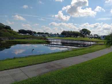 This Beautiful, well maintained home is located with views of on Four Lakes Golf Club in Florida - for sale on GolfHomes.com, golf home, golf lot