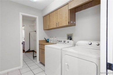 This 3 bedroom, 2 bath, 2 garage home in Oakleaf Villas has on Sugarmill Woods Golf and Country Club in Florida - for sale on GolfHomes.com, golf home, golf lot
