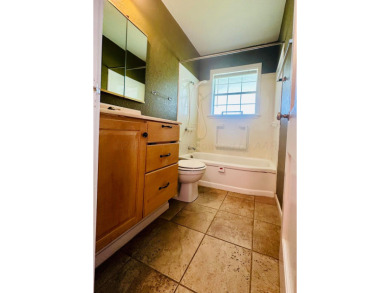 Nestled on a large lot in a well-kept neighborhood, this on Phillips Country Club in Texas - for sale on GolfHomes.com, golf home, golf lot