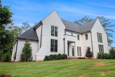 Set on a sprawling 1-acre lot in an established, tree-lined on Dunwoody Country Club in Georgia - for sale on GolfHomes.com, golf home, golf lot