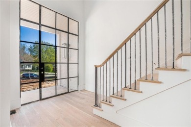 Set on a sprawling 1-acre lot in an established, tree-lined on Dunwoody Country Club in Georgia - for sale on GolfHomes.com, golf home, golf lot