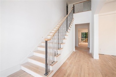 Set on a sprawling 1-acre lot in an established, tree-lined on Dunwoody Country Club in Georgia - for sale on GolfHomes.com, golf home, golf lot