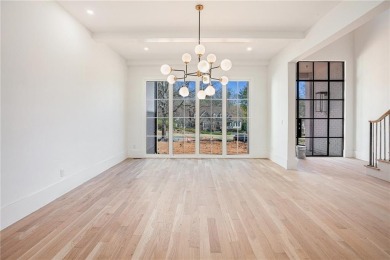 Set on a sprawling 1-acre lot in an established, tree-lined on Dunwoody Country Club in Georgia - for sale on GolfHomes.com, golf home, golf lot