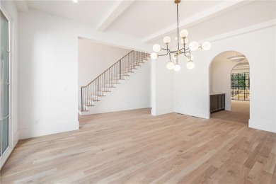 Set on a sprawling 1-acre lot in an established, tree-lined on Dunwoody Country Club in Georgia - for sale on GolfHomes.com, golf home, golf lot