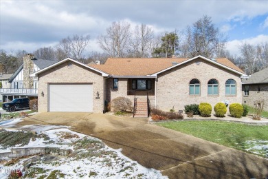 This distinguished all brick home sits on the 11th green of the on Druid Hills Golf Club in Tennessee - for sale on GolfHomes.com, golf home, golf lot