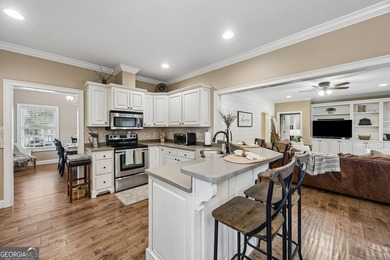 Immaculate and beautifully refreshed, this exceptional residence on The Golf Club At Sanctuary Cove in Georgia - for sale on GolfHomes.com, golf home, golf lot