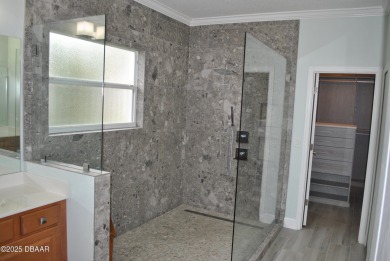 Stunning 4-bedroom, 3-bath home located in the highly desired on LPGA International Golf Course in Florida - for sale on GolfHomes.com, golf home, golf lot