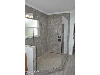 Stunning 4-bedroom, 3-bath home located in the highly desired on LPGA International Golf Course in Florida - for sale on GolfHomes.com, golf home, golf lot