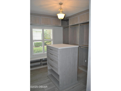 Stunning 4-bedroom, 3-bath home located in the highly desired on LPGA International Golf Course in Florida - for sale on GolfHomes.com, golf home, golf lot