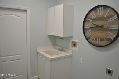 Stunning 4-bedroom, 3-bath home located in the highly desired on LPGA International Golf Course in Florida - for sale on GolfHomes.com, golf home, golf lot