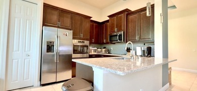 Stunning Isabella Model in PGA Verano featuring 2BR, 2 BA, a den on PGA Golf Club in PGA Village in Florida - for sale on GolfHomes.com, golf home, golf lot