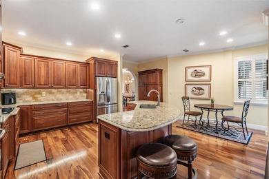 Set on an exceptional oversized wooded corner lot, nearly half on East Lake Woodlands Country Club in Florida - for sale on GolfHomes.com, golf home, golf lot