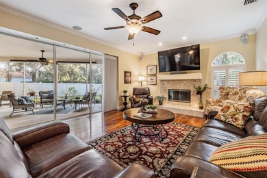 Set on an exceptional oversized wooded corner lot, nearly half on East Lake Woodlands Country Club in Florida - for sale on GolfHomes.com, golf home, golf lot