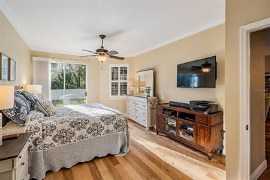 Set on an exceptional oversized wooded corner lot, nearly half on East Lake Woodlands Country Club in Florida - for sale on GolfHomes.com, golf home, golf lot