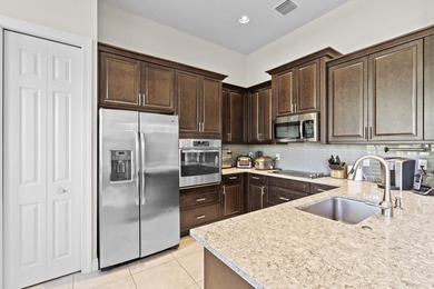 Stunning Isabella Model in PGA Verano featuring 2BR, 2 BA, a den on PGA Golf Club in PGA Village in Florida - for sale on GolfHomes.com, golf home, golf lot