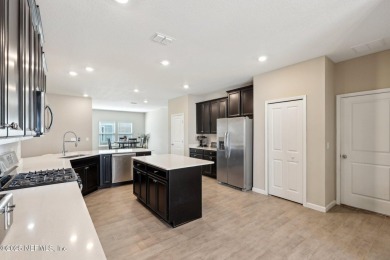 Discover modern sophistication in this popular Tivoli model on Eagle Landing Golf Club in Florida - for sale on GolfHomes.com, golf home, golf lot