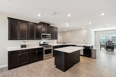 Discover modern sophistication in this popular Tivoli model on Eagle Landing Golf Club in Florida - for sale on GolfHomes.com, golf home, golf lot