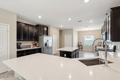Discover modern sophistication in this popular Tivoli model on Eagle Landing Golf Club in Florida - for sale on GolfHomes.com, golf home, golf lot