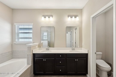 Discover modern sophistication in this popular Tivoli model on Eagle Landing Golf Club in Florida - for sale on GolfHomes.com, golf home, golf lot