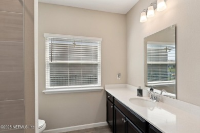 Discover modern sophistication in this popular Tivoli model on Eagle Landing Golf Club in Florida - for sale on GolfHomes.com, golf home, golf lot