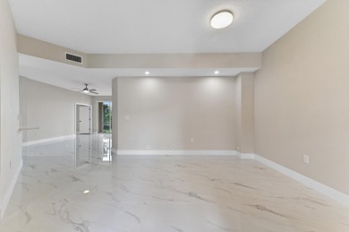 Introducing a sophisticatedly updated residence at 12454 Crystal on Westchester Golf and Country Club in Florida - for sale on GolfHomes.com, golf home, golf lot