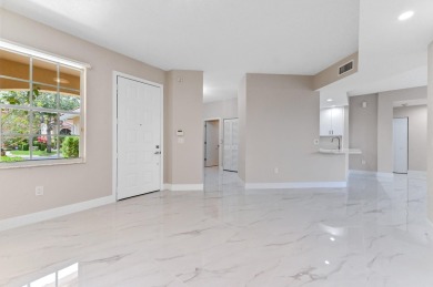 Introducing a sophisticatedly updated residence at 12454 Crystal on Westchester Golf and Country Club in Florida - for sale on GolfHomes.com, golf home, golf lot