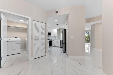 Introducing a sophisticatedly updated residence at 12454 Crystal on Westchester Golf and Country Club in Florida - for sale on GolfHomes.com, golf home, golf lot