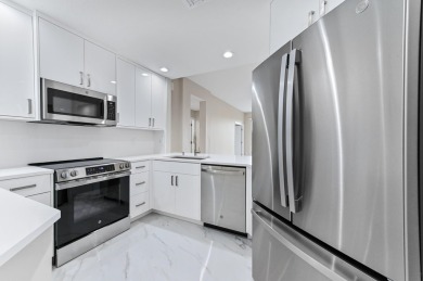 Introducing a sophisticatedly updated residence at 12454 Crystal on Westchester Golf and Country Club in Florida - for sale on GolfHomes.com, golf home, golf lot