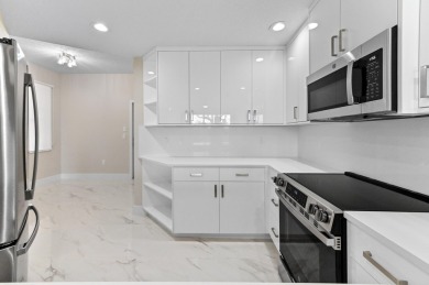 Introducing a sophisticatedly updated residence at 12454 Crystal on Westchester Golf and Country Club in Florida - for sale on GolfHomes.com, golf home, golf lot