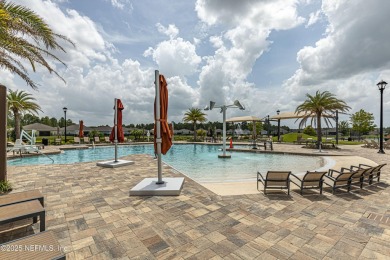Discover modern sophistication in this popular Tivoli model on Eagle Landing Golf Club in Florida - for sale on GolfHomes.com, golf home, golf lot