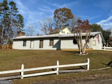 Beautiful view of mountains and water from this unrestricted lot on Currahee Golf Club in Georgia - for sale on GolfHomes.com, golf home, golf lot