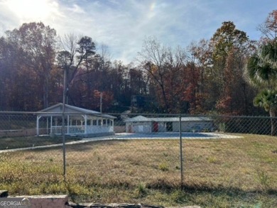 Beautiful view of mountains and water from this unrestricted lot on Currahee Golf Club in Georgia - for sale on GolfHomes.com, golf home, golf lot