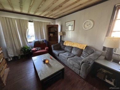 Welcome to this affordable 4-bedroom, 1-bath home situated on a on Crystal View Municipal Golf Course in Michigan - for sale on GolfHomes.com, golf home, golf lot