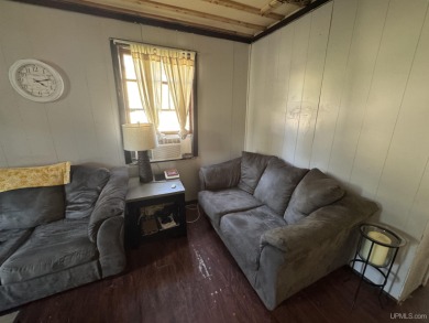 Welcome to this affordable 4-bedroom, 1-bath home situated on a on Crystal View Municipal Golf Course in Michigan - for sale on GolfHomes.com, golf home, golf lot