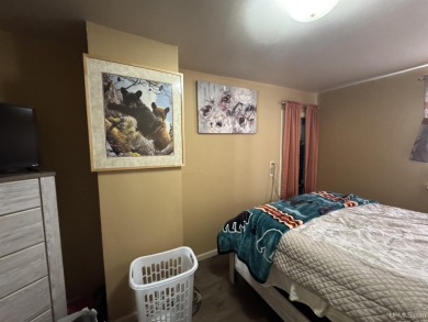 Welcome to this affordable 4-bedroom, 1-bath home situated on a on Crystal View Municipal Golf Course in Michigan - for sale on GolfHomes.com, golf home, golf lot
