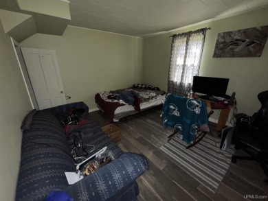 Welcome to this affordable 4-bedroom, 1-bath home situated on a on Crystal View Municipal Golf Course in Michigan - for sale on GolfHomes.com, golf home, golf lot