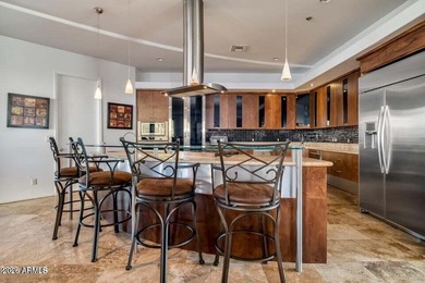 The Belgard pavers of the circular driveway lead up to this on Troon North Golf Club  in Arizona - for sale on GolfHomes.com, golf home, golf lot