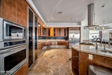 The Belgard pavers of the circular driveway lead up to this on Troon North Golf Club  in Arizona - for sale on GolfHomes.com, golf home, golf lot