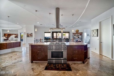 The Belgard pavers of the circular driveway lead up to this on Troon North Golf Club  in Arizona - for sale on GolfHomes.com, golf home, golf lot