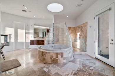 The Belgard pavers of the circular driveway lead up to this on Troon North Golf Club  in Arizona - for sale on GolfHomes.com, golf home, golf lot