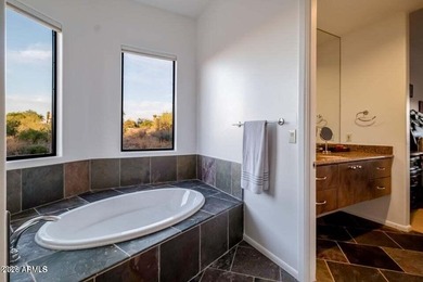 The Belgard pavers of the circular driveway lead up to this on Troon North Golf Club  in Arizona - for sale on GolfHomes.com, golf home, golf lot