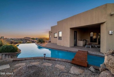 The Belgard pavers of the circular driveway lead up to this on Troon North Golf Club  in Arizona - for sale on GolfHomes.com, golf home, golf lot